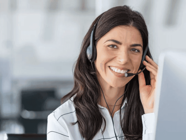 Construction worker in safety vest and hard hat using tablet